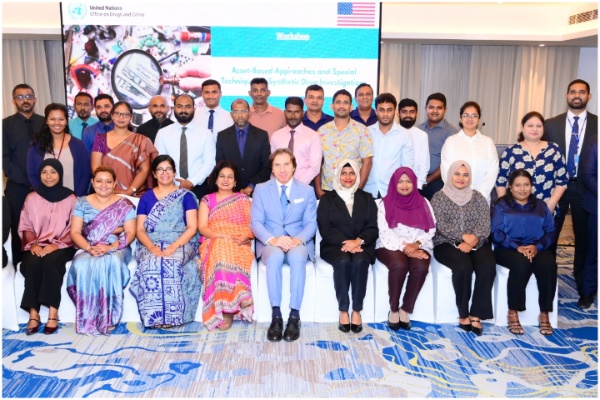 Participants seated together for a group photograph.