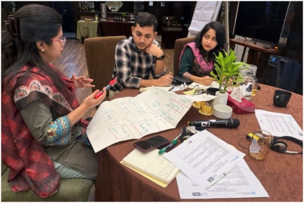Participants discussing during a group activity at the workshop.
