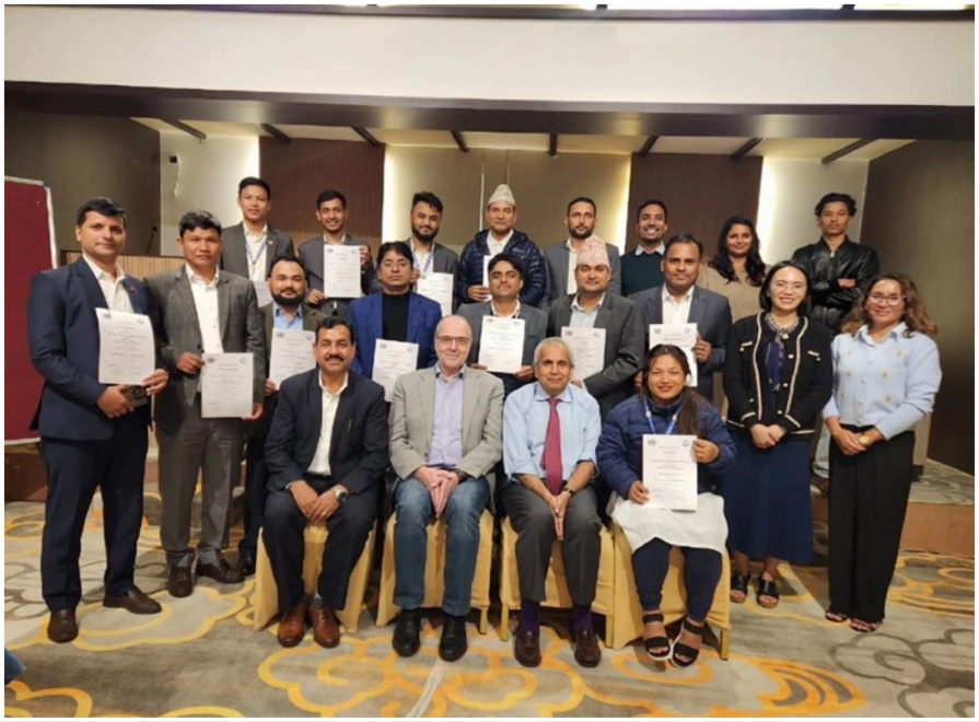 Participants seated together for a group photograph.