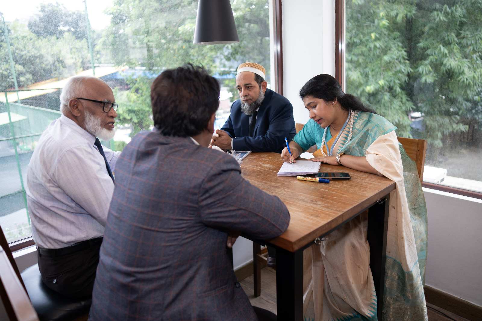 Four participants discussing in a group.